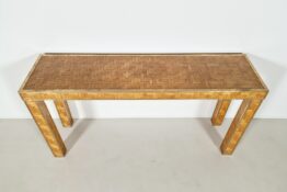 Woven rattan console table with brass